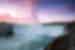 Gentle mist drifts off Niagara Falls at sunset in southern Canada