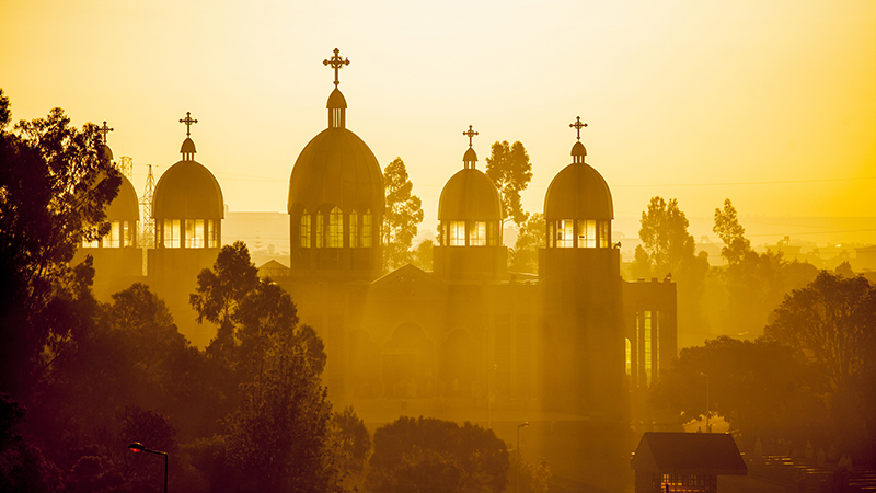 The silhouette of a church at sunset in Addis Ababa, Ethiopia 