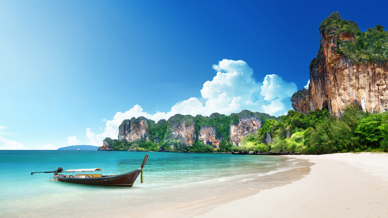 A boat moored up on Railay Beach in Krabi, Thailand