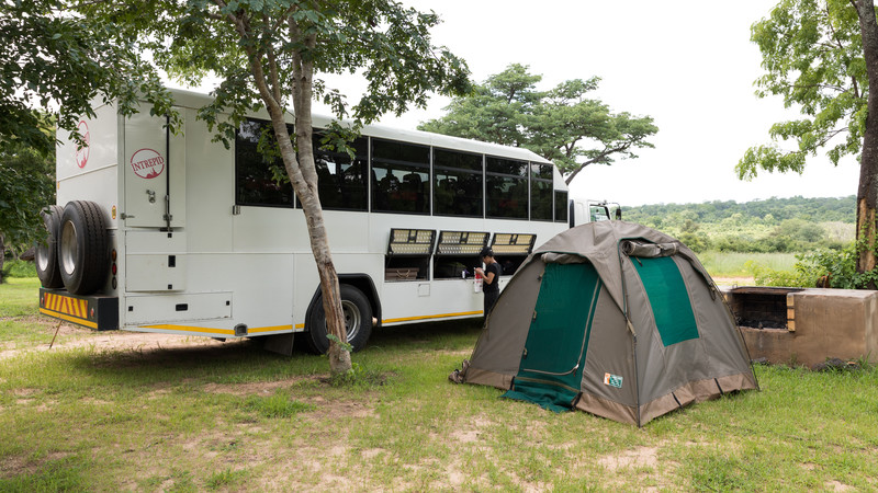 Tent pitched beside overland truck