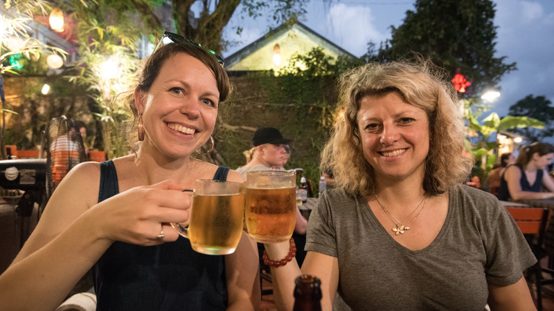 Two women drinking beer in Vietnam