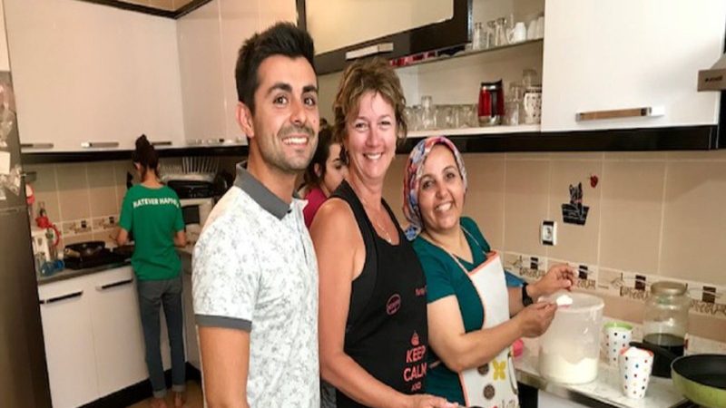 Three people at a cooking class 