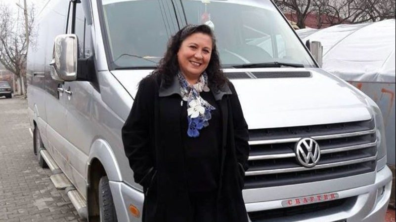 Female bus driver in front of van in Turkey