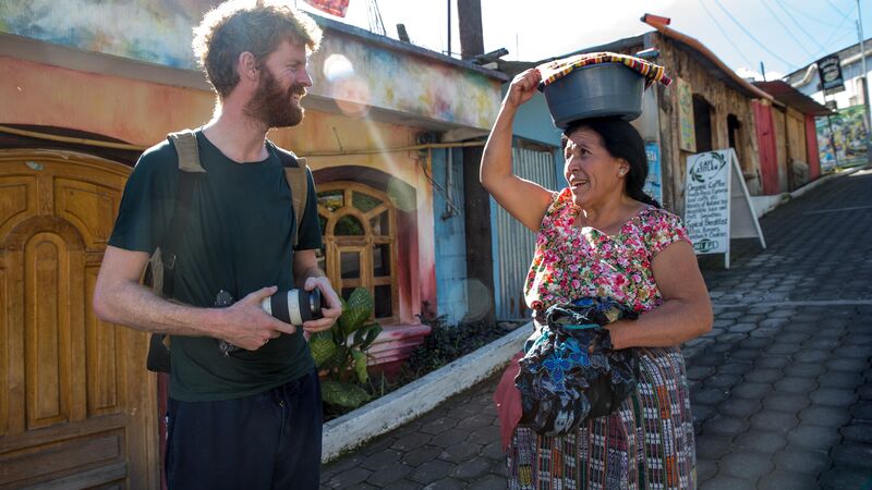 A traveller chats to a local in Guatemala