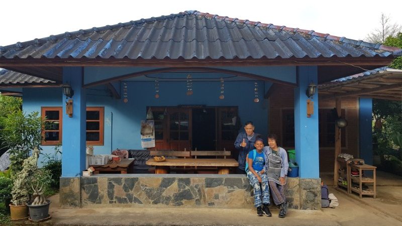 A girl with two Thai adults at a homestay in Chiang Mai