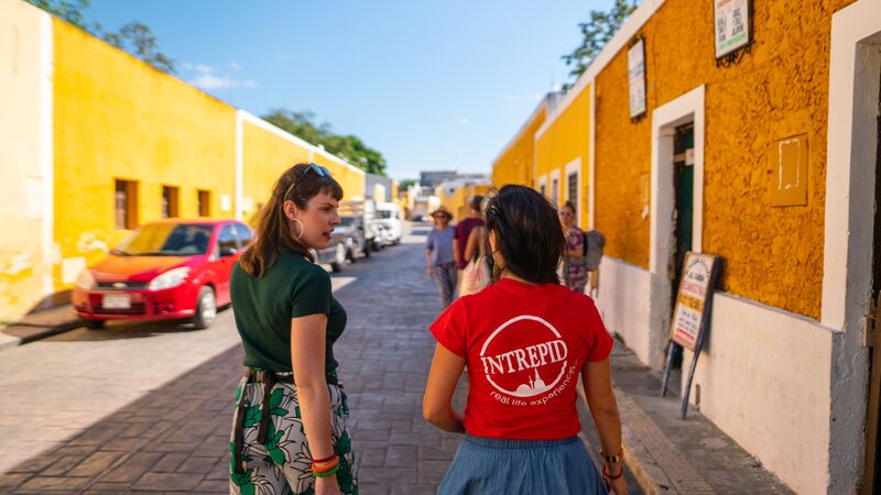 A group of travellers with a tour leader in Izamal, Mexico