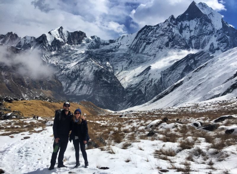 A couple standing in the mountains in Nepal