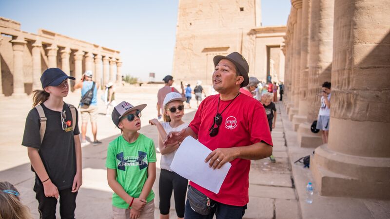 An Intrepid leader with a family group in Egypt
