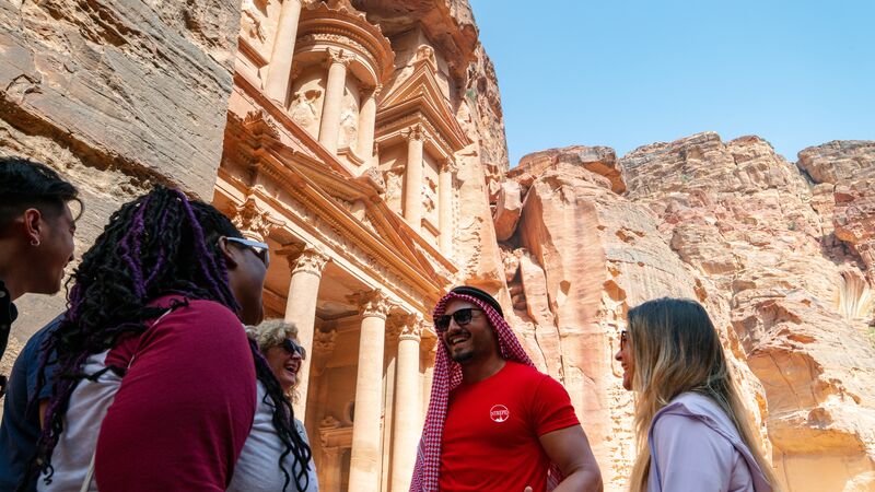 Travellers with their leader in Petra