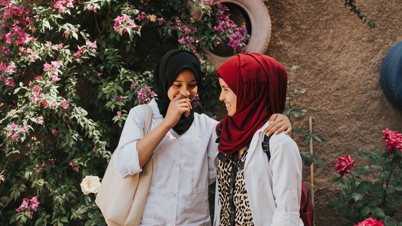 Two Moroccan girls laughing