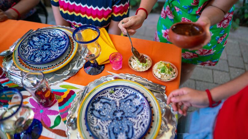 Brightly coloured plates of Mexican food