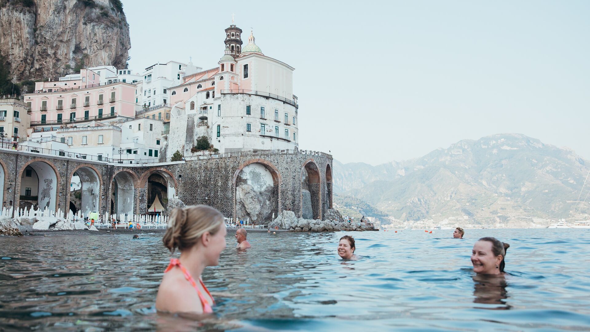 People swimming in the sea on the Amalfi Coast, Italy