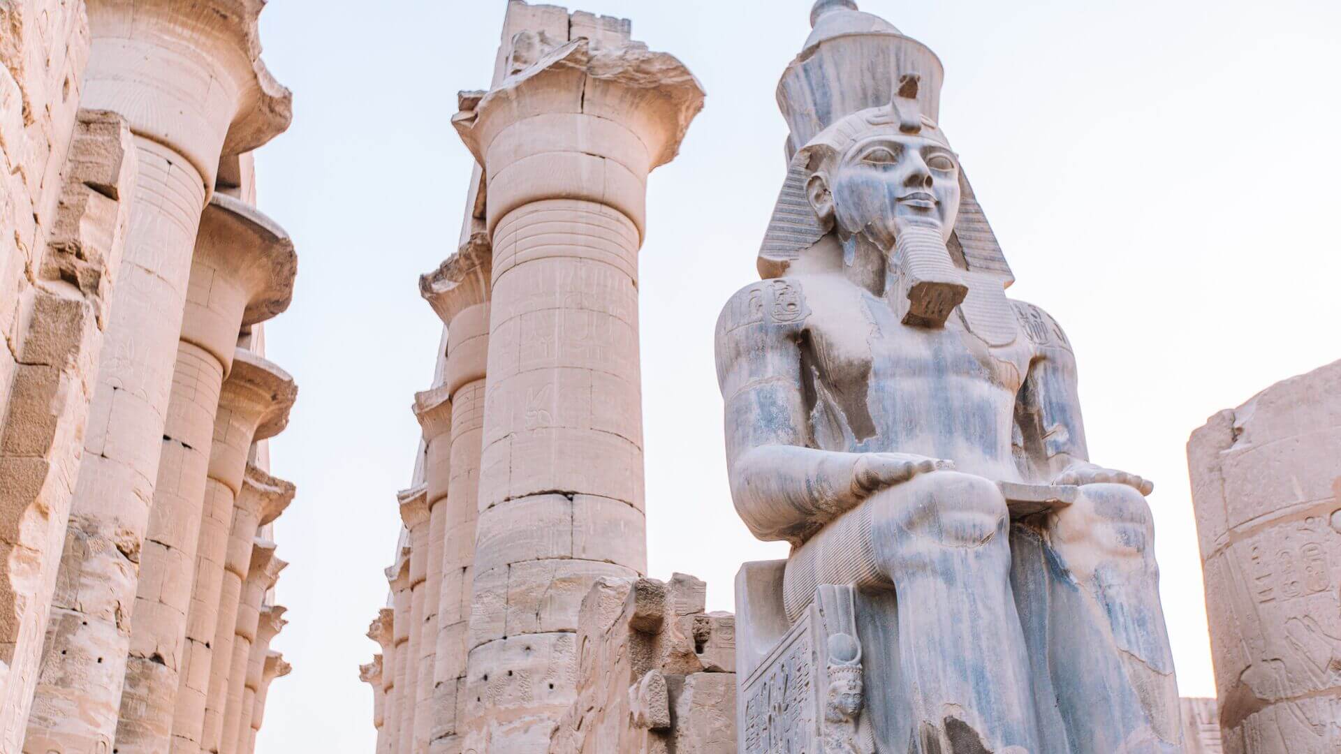 Large statue and columns at the Luxor Temple, Egypt