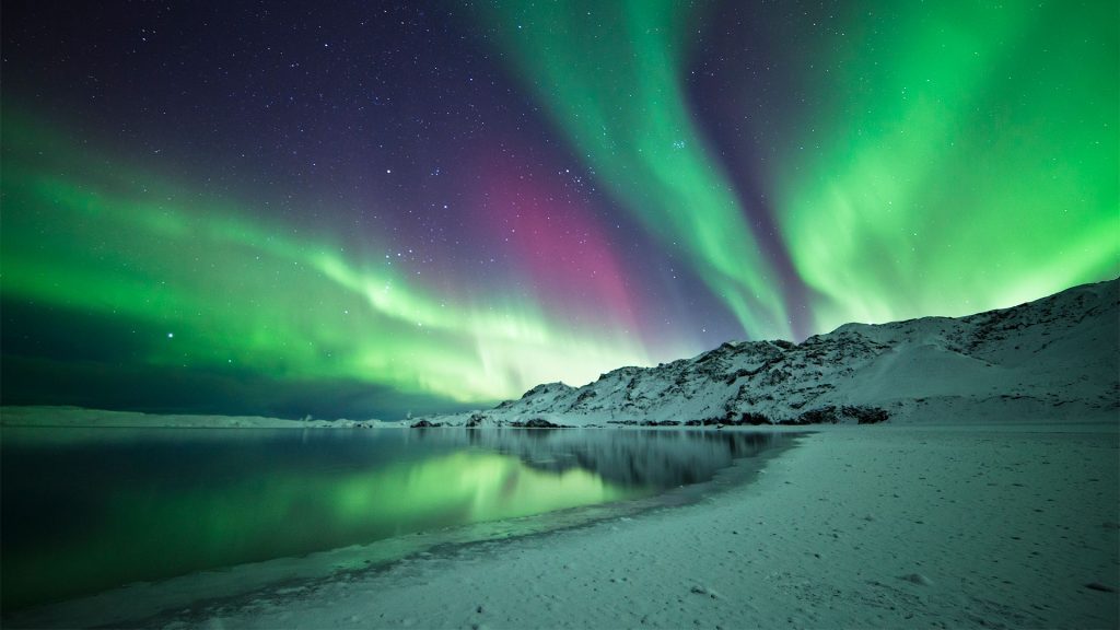 The Aurora Borealis dancing across the sky in Iceland