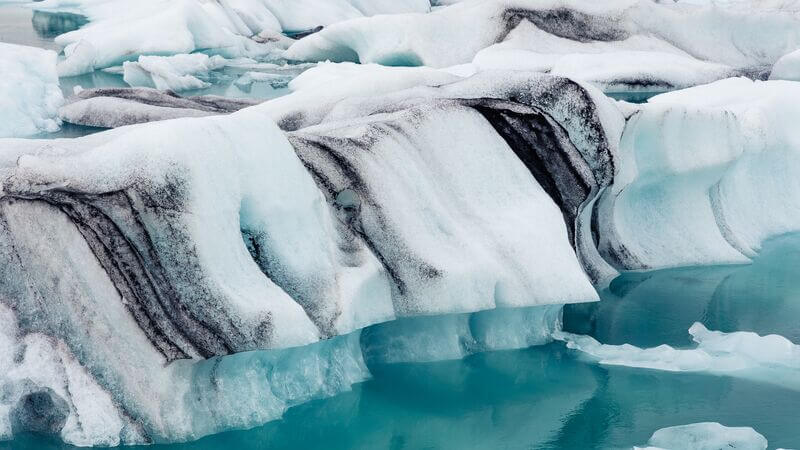 Black and white striped glacier at the Jokulsarlon Glacier Lagoon, Iceland