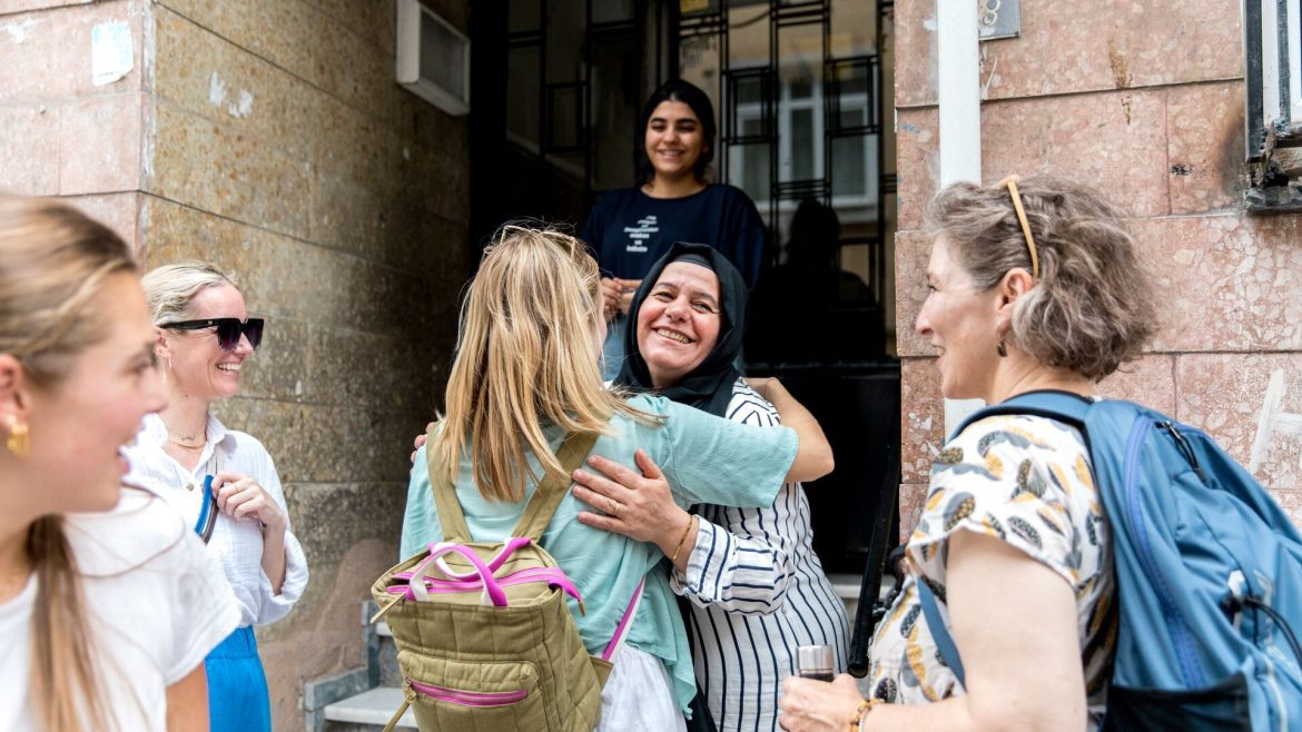 A group of four female travellers hugging and saying bye to their host in Turkey