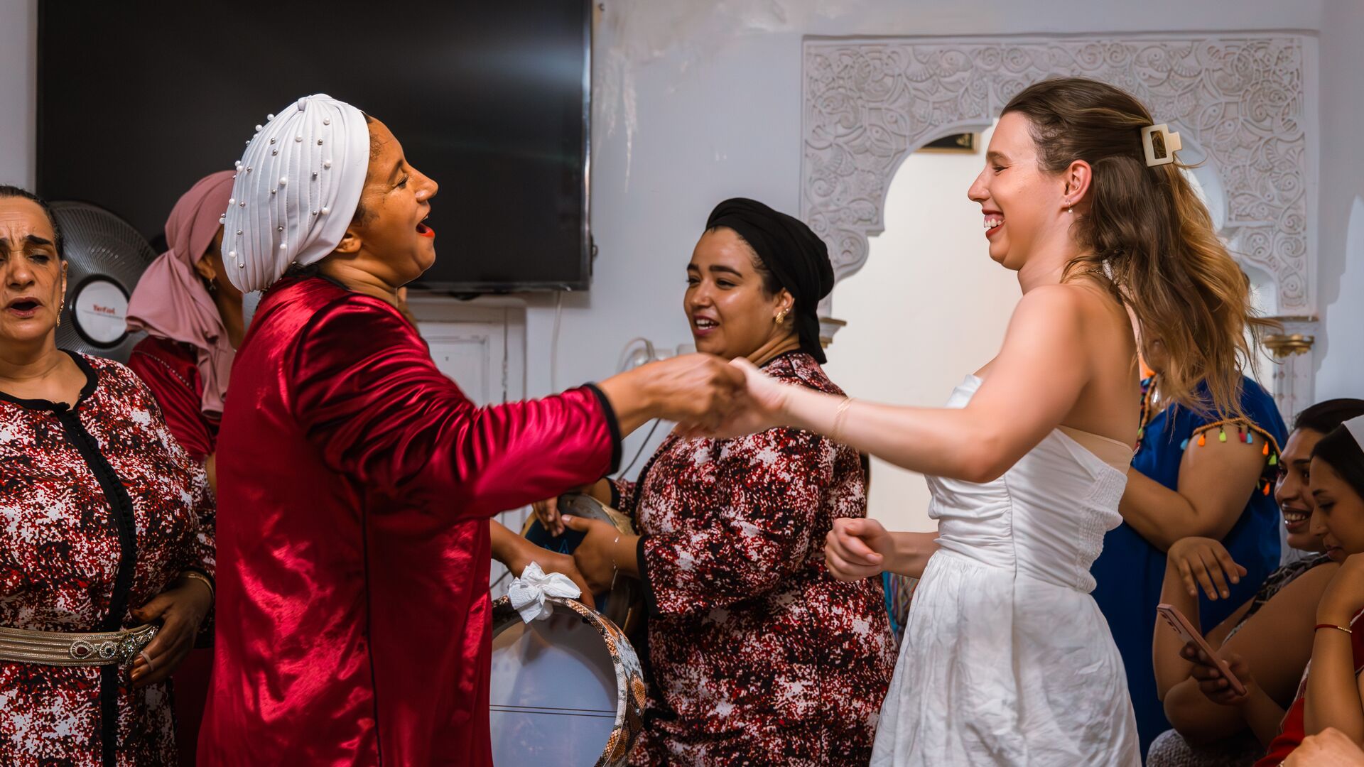 A traveller dancing with The Houariyates in Morocco 