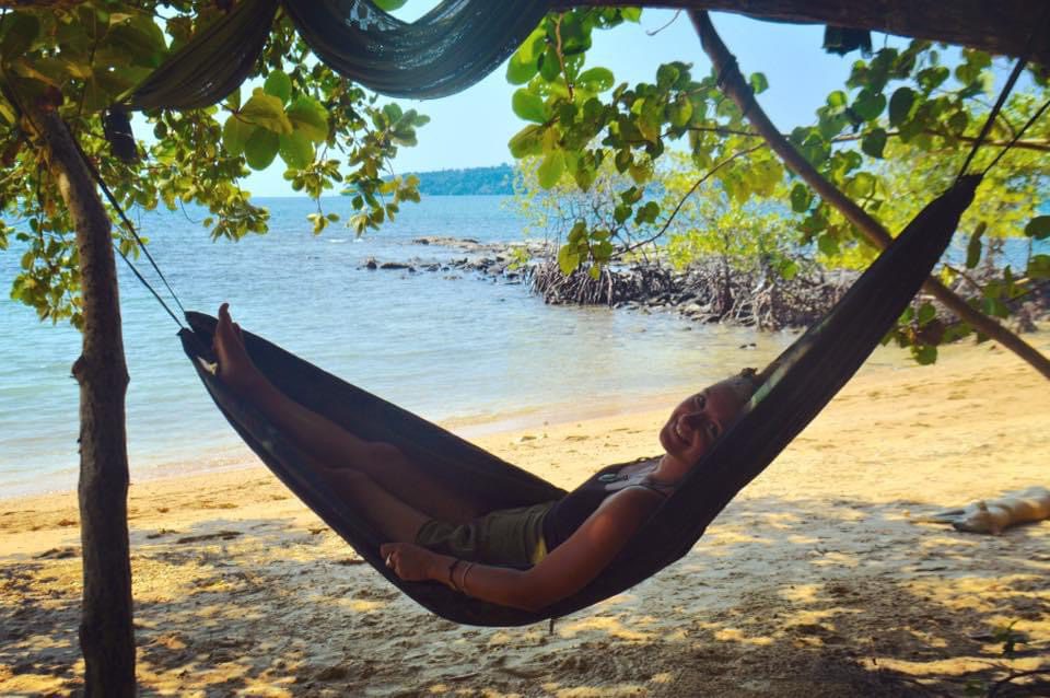 A traveller relaxing in a hammock in Koh Ta Kiev, Cambodia