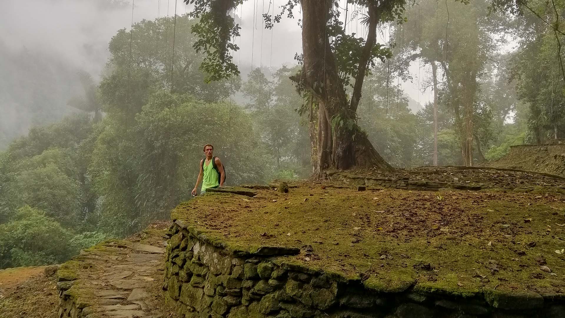 A man stands at the ancient ruins of the Lost City in the Jungle