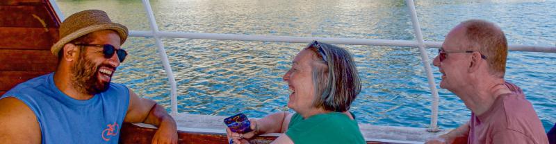 People laughing on a boat in Macedonia