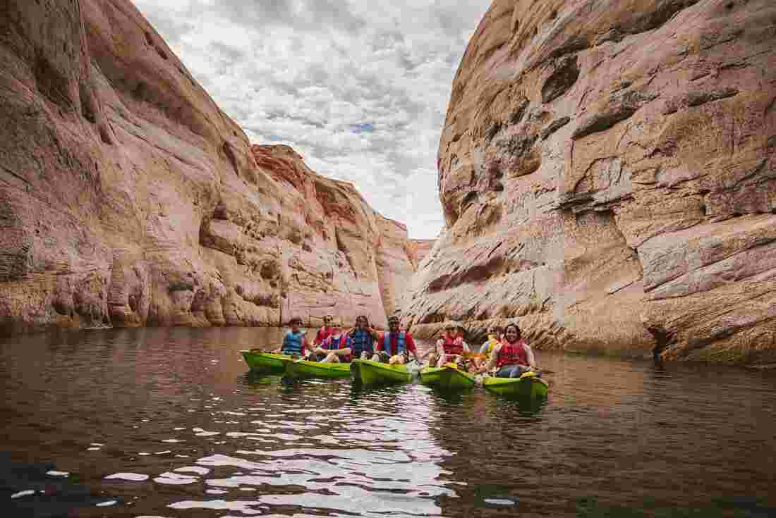 A group of travellers in their kayaks on Lake Powell in Utah, USA