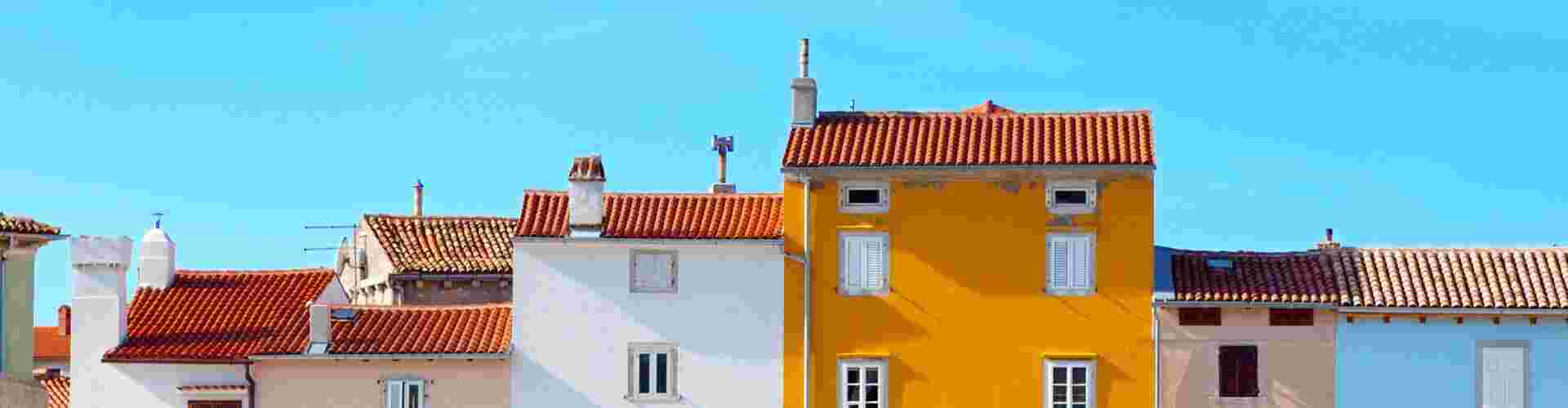 Coloured buildings and blue sky in Cres, Croatia