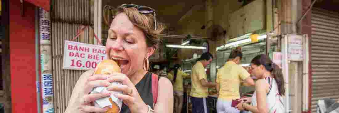 A traveller enjoying Vietnamese food