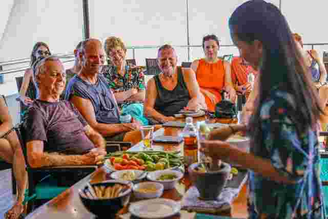 A group of older people enjoying a cooking class in Thailand