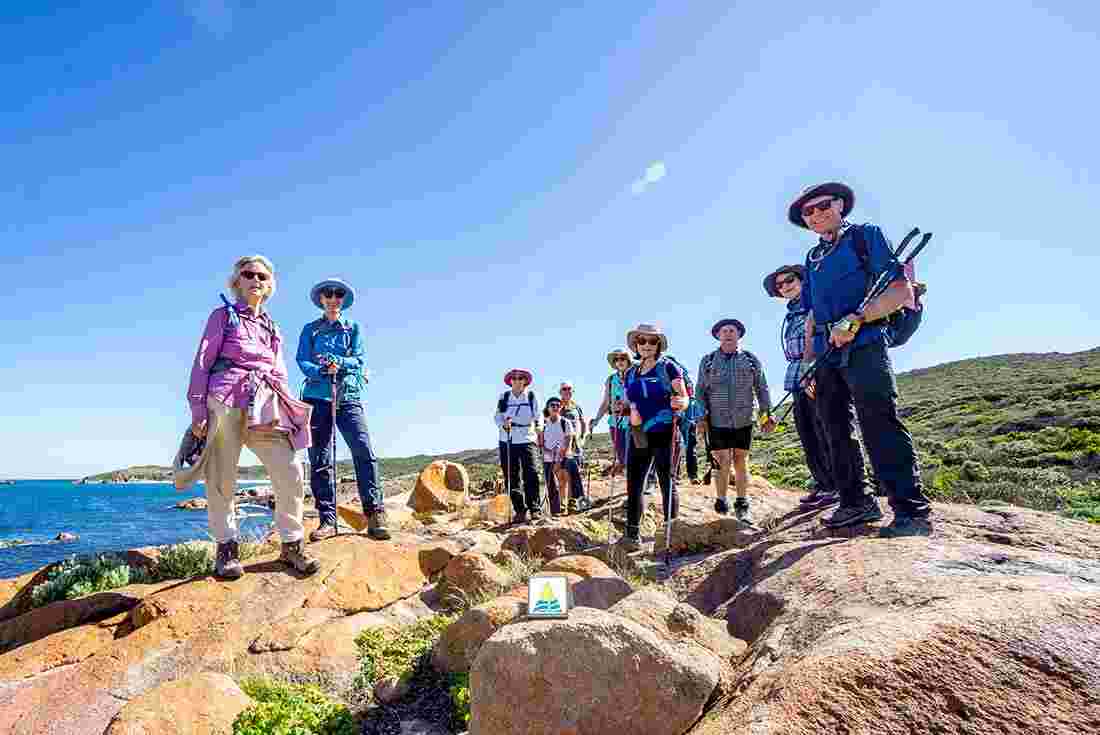 Hikers posing on Cape To Cape track, Australia