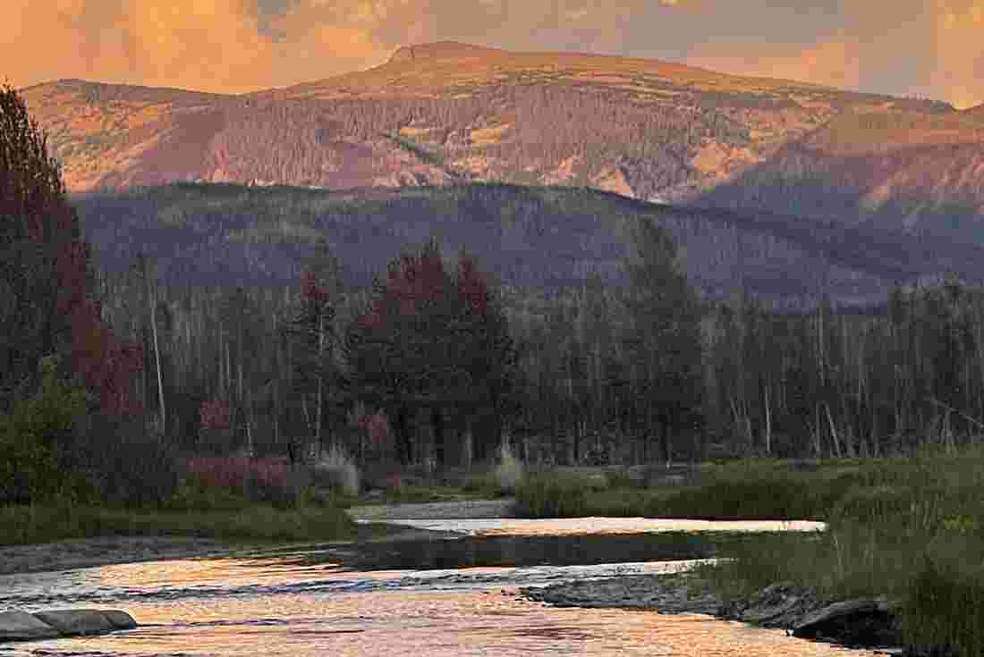 View of Mount Ida beside the river in the valley, Colorado, USA