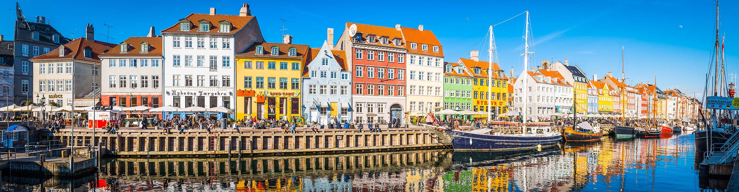 Best Denmark Tours Holidays 2024 2025 Intrepid Travel AU   Intrepid Travel Denmark GettyImages 902489426 Copenhagen Nyhavn Panorama City Crowds Enjoying Sunshine Restaurants Bars Denmark 2560 