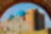 The cerulean domes of  Khoja Ahmed Yasawi Mausoleum visible through a sandstone arch, Turkistan, Khazakhstan
