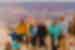 Intrepid travellers gather for a group photo at Ooh Aah Point lookout with the majestic Grand Canyon behind them