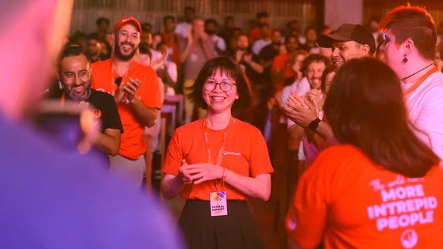 An Intrepid employee celebrates at Global Summit.