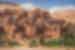Ancient earthen city of Ait Benhaddou stacks up the hill of the desert in Morocco