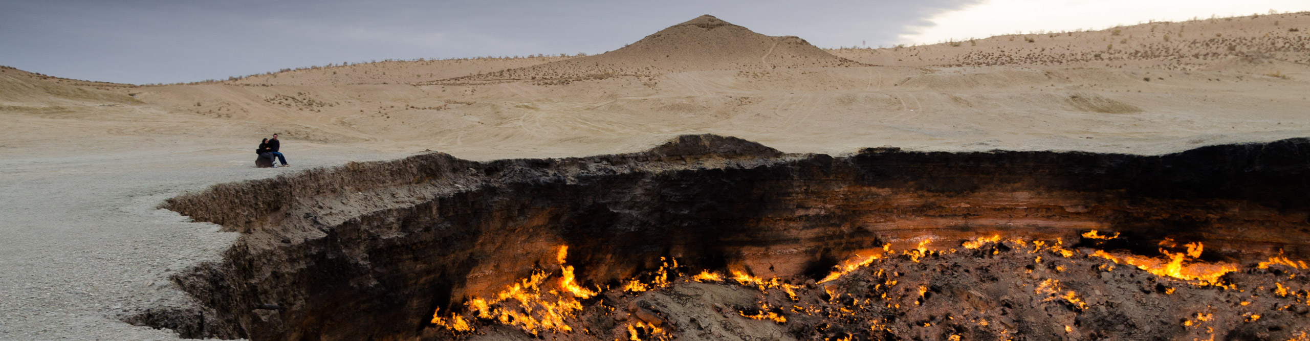 Best Turkmenistan Tours Holidays 2024 2025 Intrepid Travel UK   Intrepid Travel Asia SS 660298027 2560 Couple Looking At The Darwaza Gas Crater Turkmenistan 