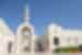 Exterior of the Grand Mosque in Muscat with travellers carrying through to the interior in Oman