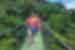QBPR - Two travellers crossing bridge in Monteverde, Costa Rica