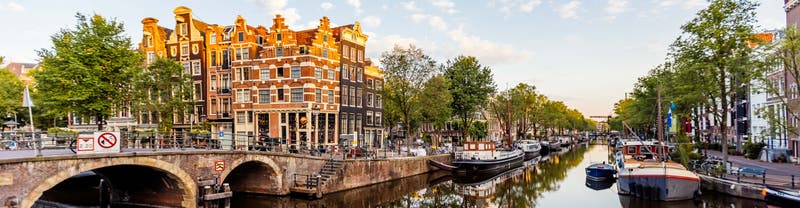 Intrepid Travel Netherlands GettyImages 1407111882 2560 Traditional Dutch Houses Reflecting In The Canal In Jordaan Neighbourhood Amsterdam Netherlands ?width=800&crop=2560%2C667%2Coffset X50%2Coffset Y50&quality=75&format=pjpg&auto=webp
