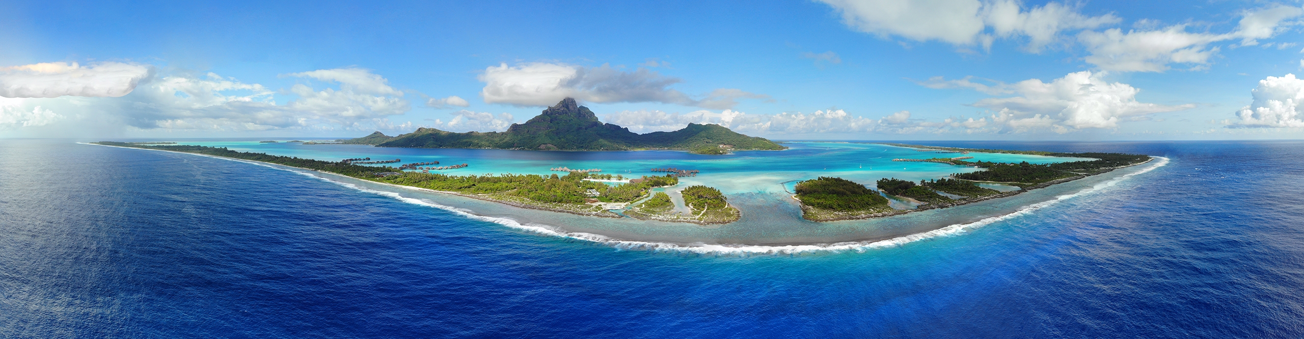 Best French Polynesia Tours Holidays 2024 2025 Intrepid Travel AU   Intrepid Travel Shutterstock 1319720279 Aerial Panoramic Landscape View Of The Island Of Bora Bora In French Polynesia With The Mont Otemanu Mountain Surrounded By A Turquoise Lagoon Motu Atolls Reef Barrier And The South Pacific Ocean 