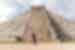 Traveller posing in front of El Castillo Pyramid at Chichen Itza, Mayan ruins in Mexica
