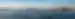A boat cruises through Lake Argyle at sunset leaving waves in water