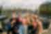 Group of travellers pose for a selfie smiling on a canal bridge in Amsterdam