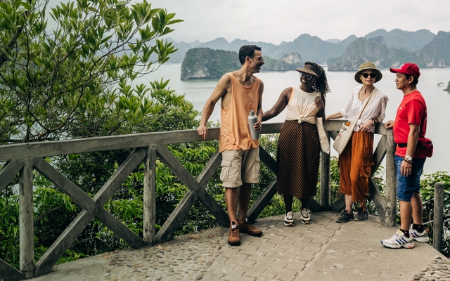 Four people in Halong Bay smiling